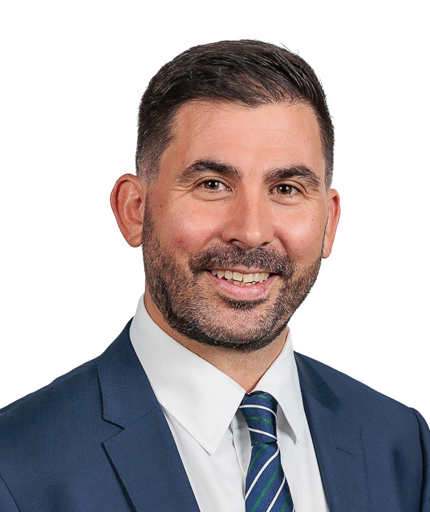 Professional headshot of a man.