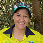 Girl wearing high vis smiling at the camera