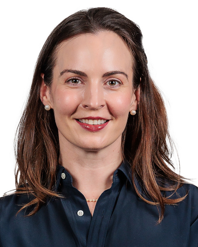 Woman sitting face on smiling at camera